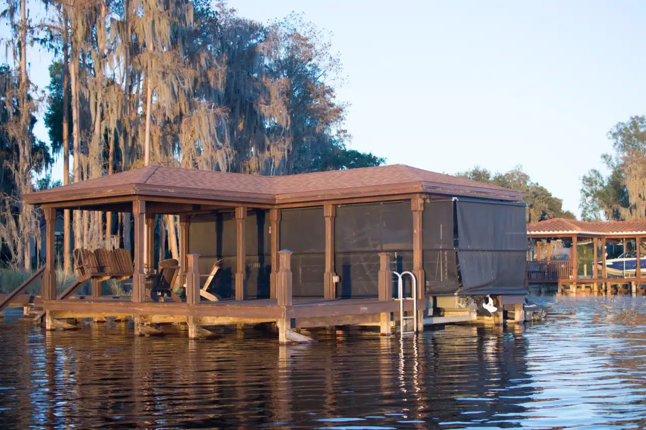 Photo of a boat dock with screen curtains and roof