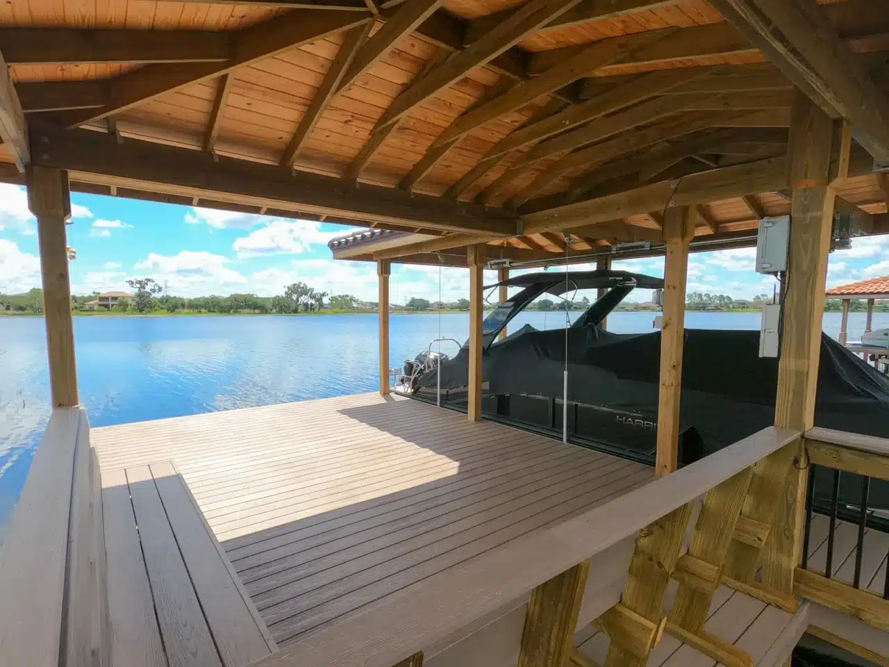 Photo of a covered boat dock with deck area