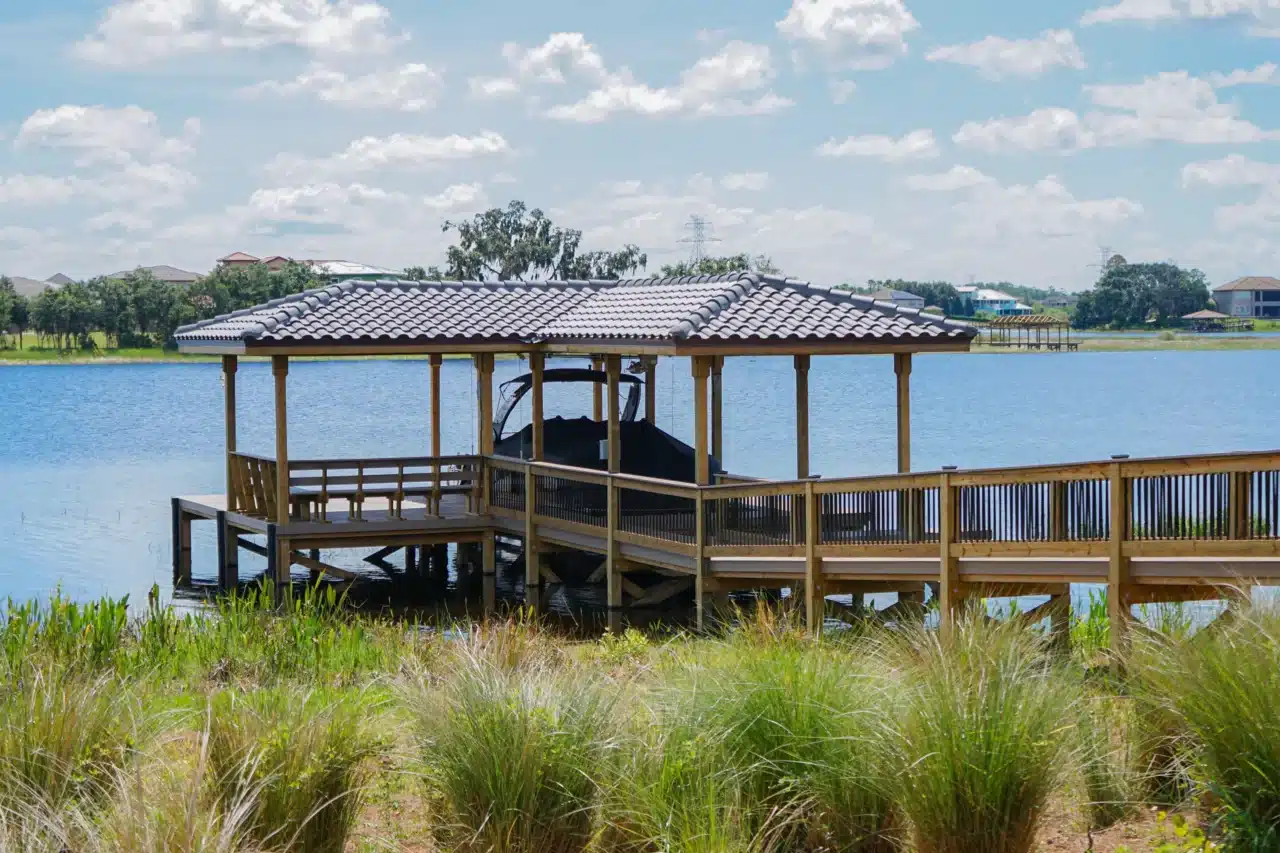 Photo of a covered boat dock with deck area and walkway