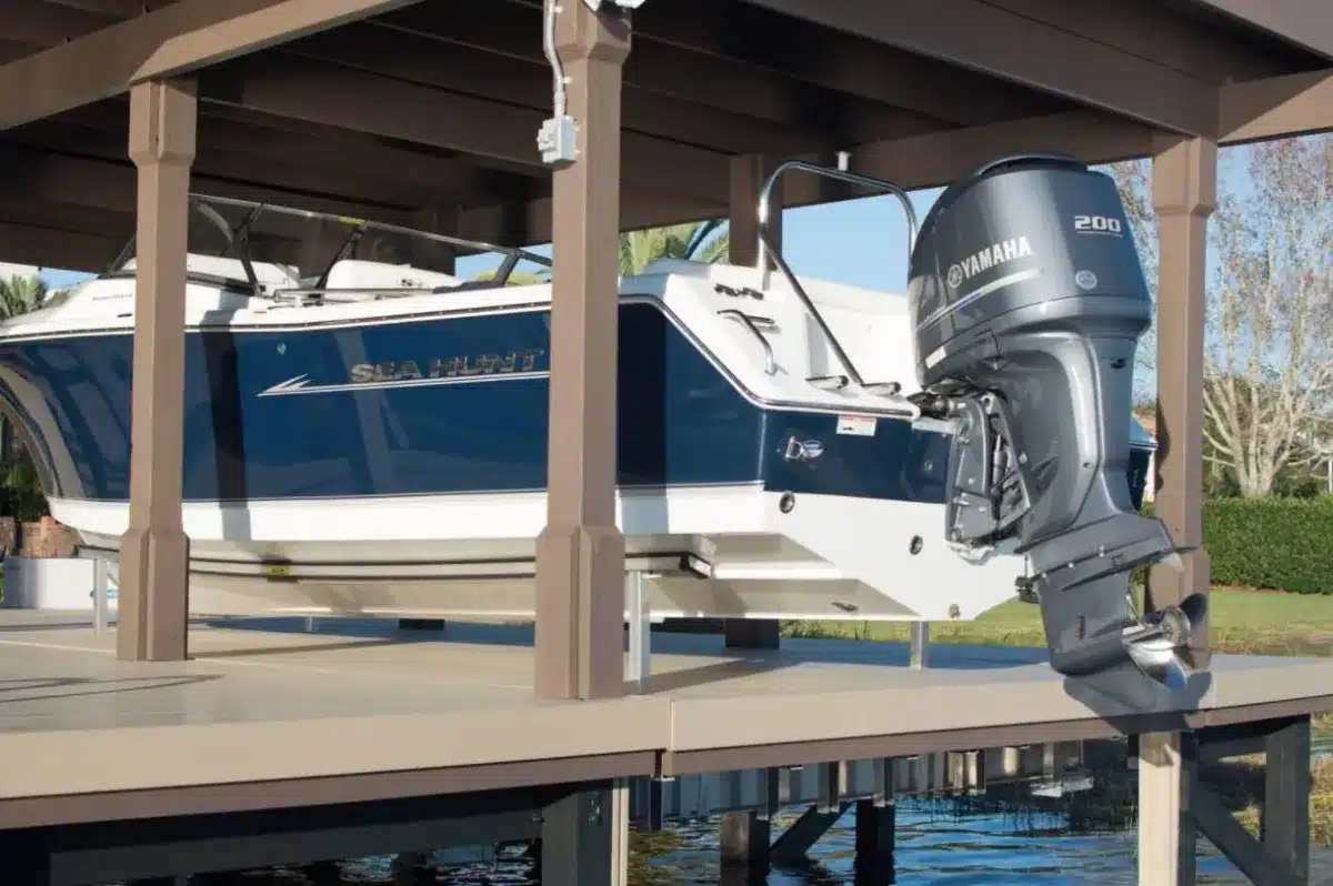 preparing a boat for a hurricane - boat on a lift in a boat dock