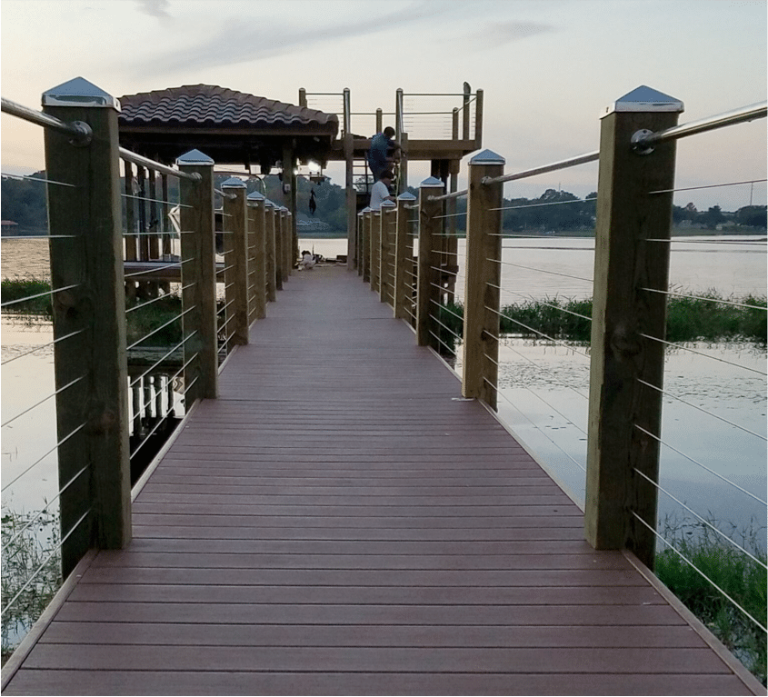 fix a dock after a hurricane - workers working on a boat dock